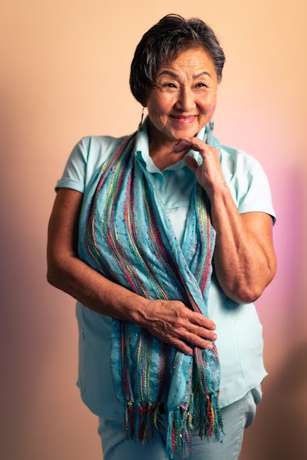Portrait of a smiling and confident mature woman with short hair.